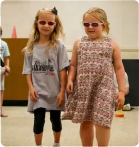 Children with sunglasses representing vision protection